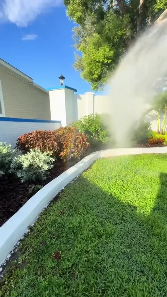 Washing a white vinyl fence and a community entrance wall, then the company end card.