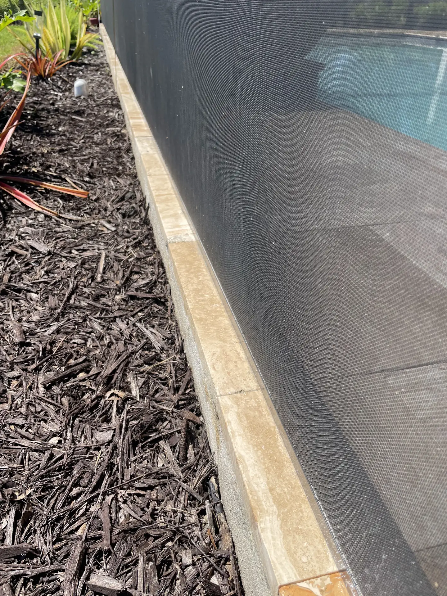 The same travertine pool deck tiles with a warmer, cleaner color