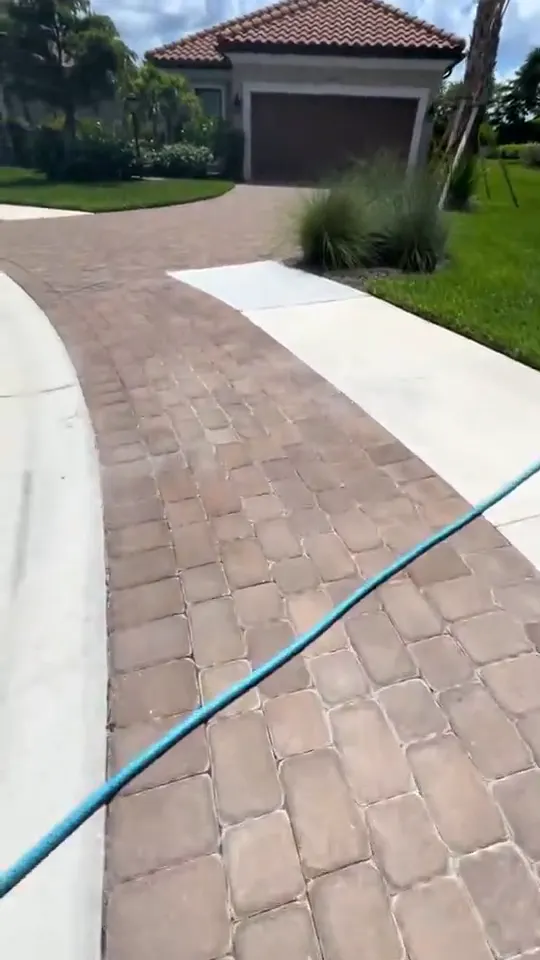 Hose and wand cleaning on paver driveways, walkways and a lanai deck.